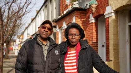 A couple affected by dementia on a cold but sunny day.